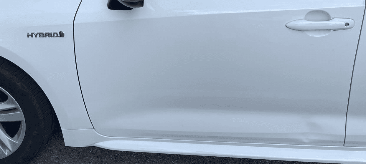 White Corolla lower door and sill dent record